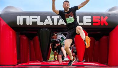 Image shows one of the giant inflatables used for the Lincoln 5k Inflatable Obstacle Race